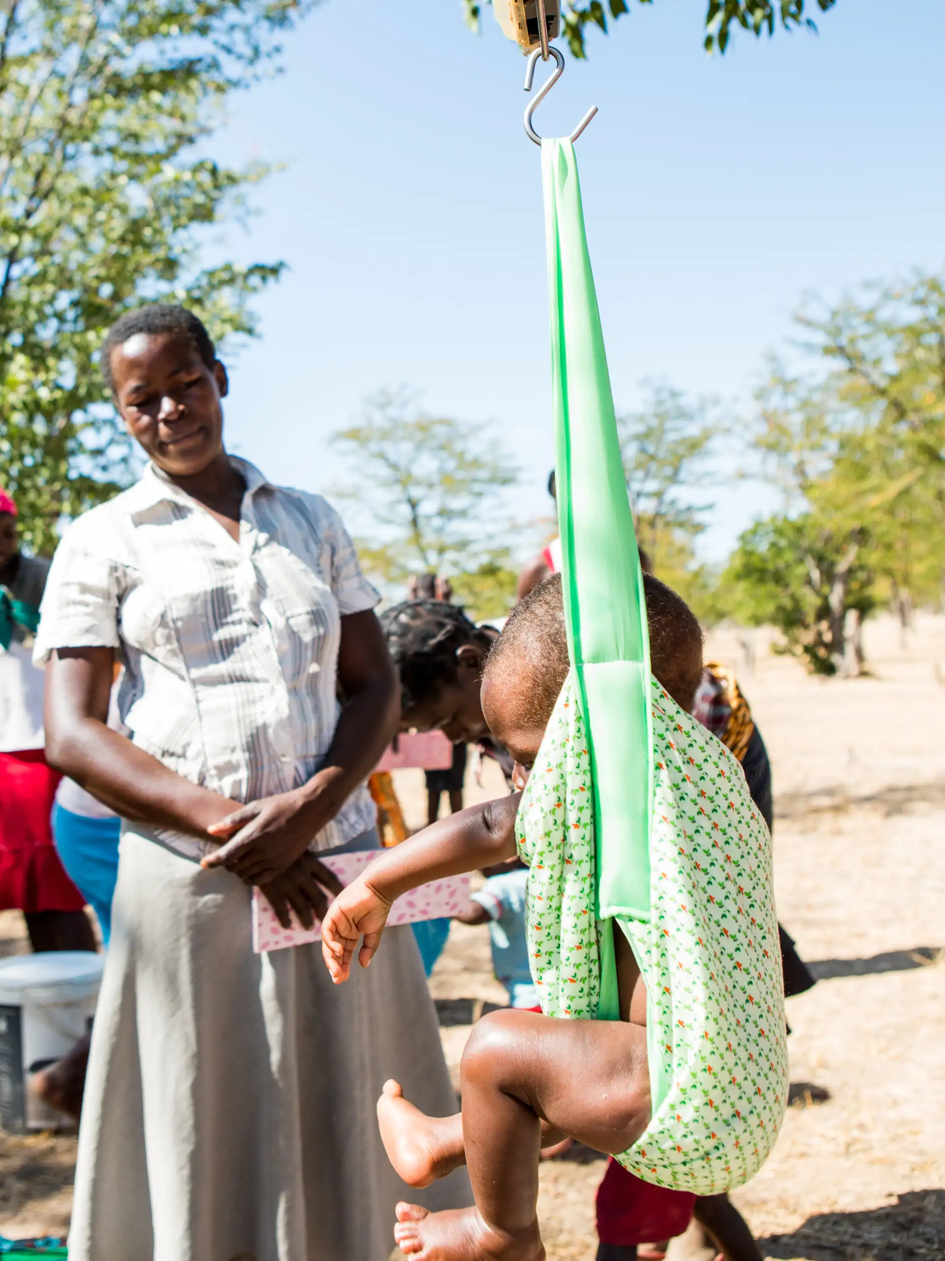 Africa - Zimbabwe - Baby Muzina being weighed