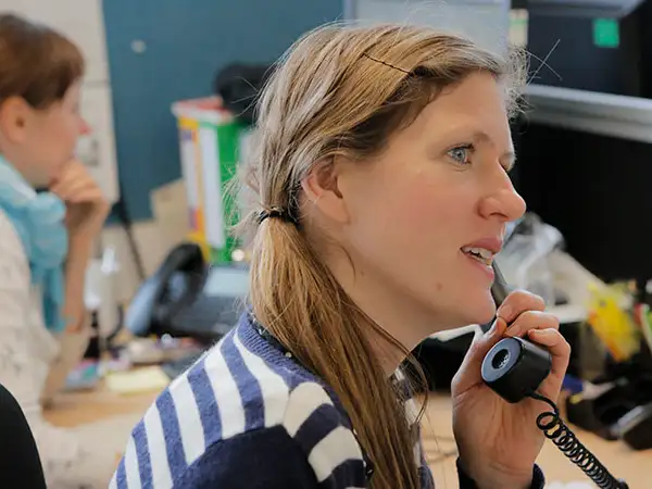 UK - London - volunteer on phone.jpg